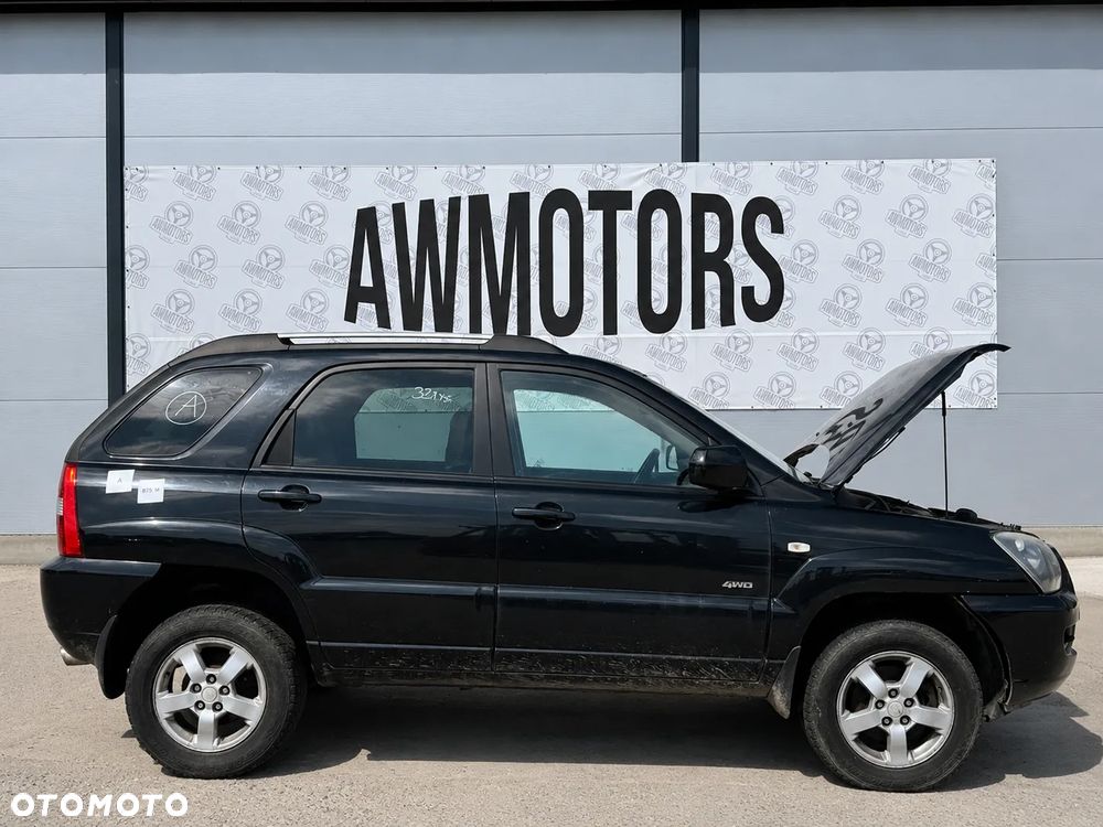 KIA SPORTAGE 2007 *SAMOCHÓD NA CZĘŚCI* 877 N BLACK PEARL MASKA, LAMPA, DRZWI, LUSTERKO, ZDERZAK, GRILL, BŁOTNIK, KLAPA, BELKA, DESKA, FOTELE, KANAPA, ĆWIARTKA KIEROWNICA, TARCZE, ZACISKI, ZAWIESZENIE, KOMPLETNY PRZÓD, KOMPLETNY TYŁ, LICZNIK, ZEGARY, PRAWE LEWE PRZÓD TYŁ - 4