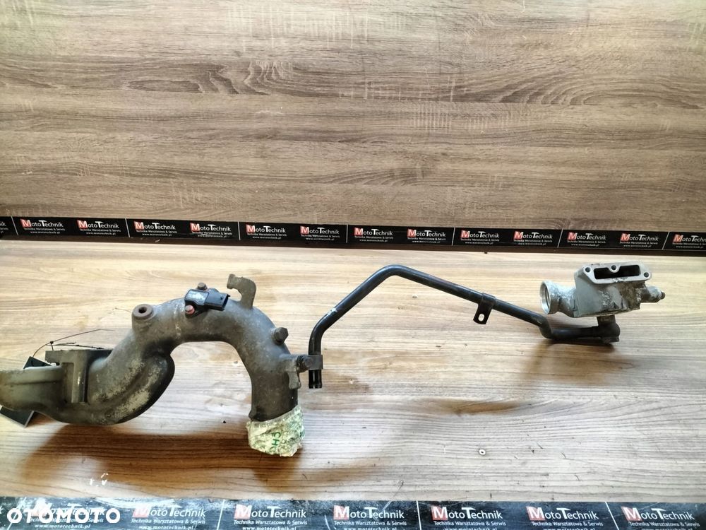 man tgl 8.180 obudowa termostatu z rurą kolektora ssącego 51.06404-3069 - 1