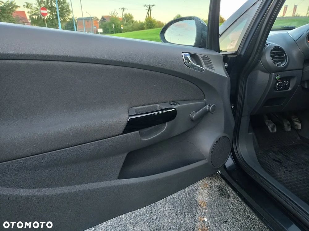 Opel Corsa 1.2 16V Enjoy - 23