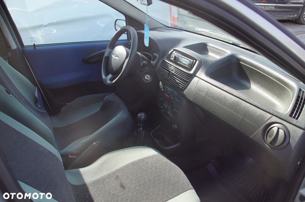 Auto na części - Fiat Punto II 1.2 8V 60 KM 188A4000 2003R Silnik Skrzynia Drzwi Maska Klapa Zderzak Błotnik Szyba Lusterko Deska Kokpit Sterownik Moduł Licznik Kierownica - 10