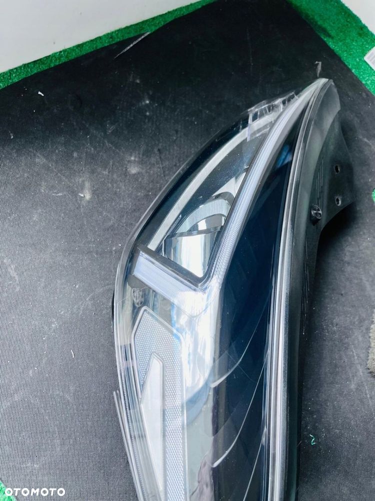 LAMPA LEWA REFLERTOR LEWY HYUNDAI TUCSON FACE LIFT ZWYKŁA HALOHENOWA H7 - 8