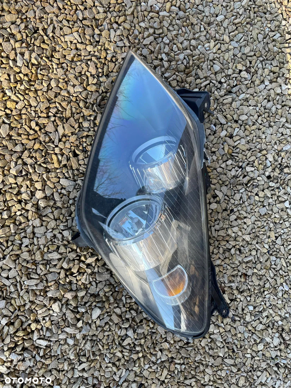 Lampa przednia lewa / refelktor Opel Astra H III