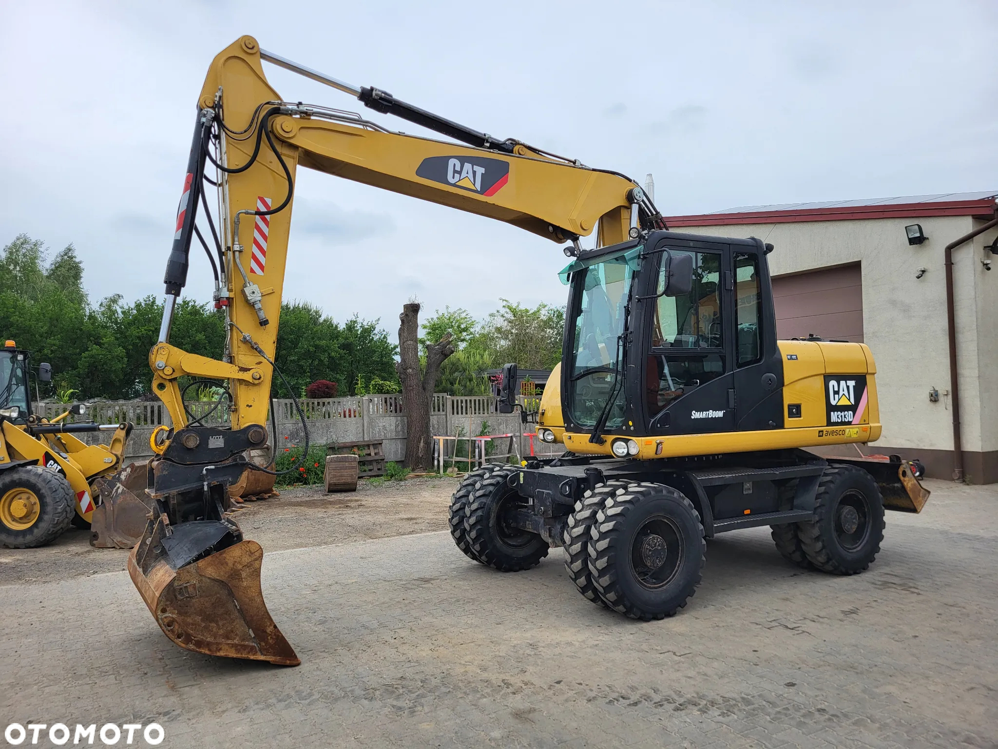 Caterpillar M 313D / z Niemiec / Stan idealny / - 2
