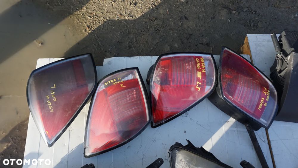 REFLEKTOR LAMPA ZBIORNIK PŁYNU SCHOWEK PASAŻERA ASTRA H - 2