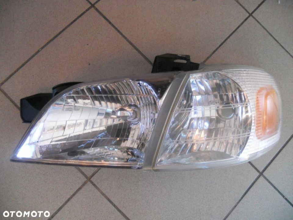 OPEL SINTRA LEWY REFLEKTOR EUROPA - 1