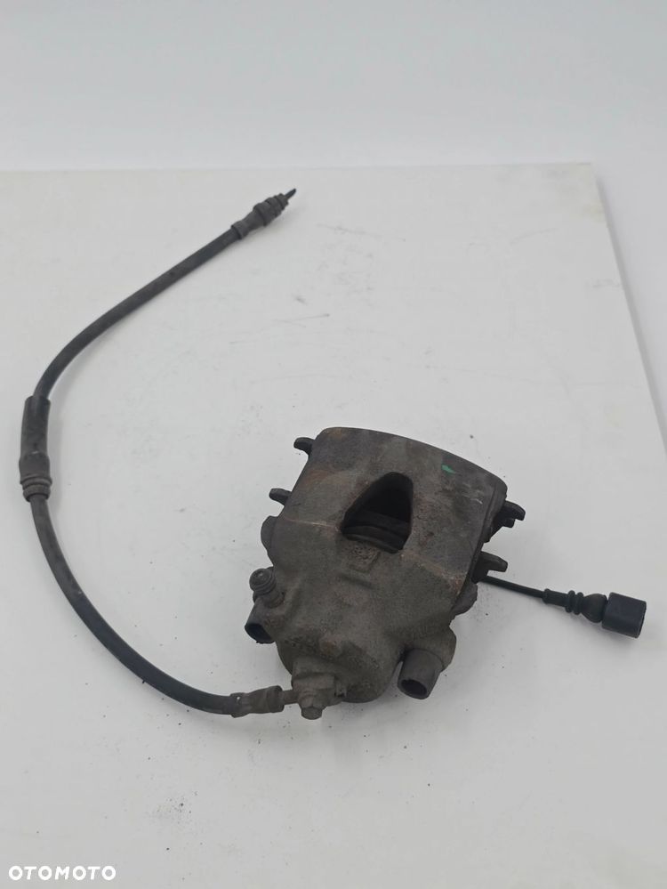 ORYGINALNY ZACISK HAMULCOWY LEWY TYŁ VW GOLF V 1K1 1K0615423