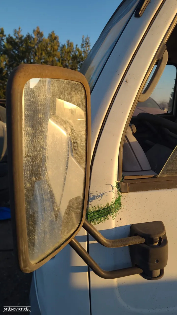 Espelho retrovisor Esquerdo com Suporte Nissan Cabstar 2000
