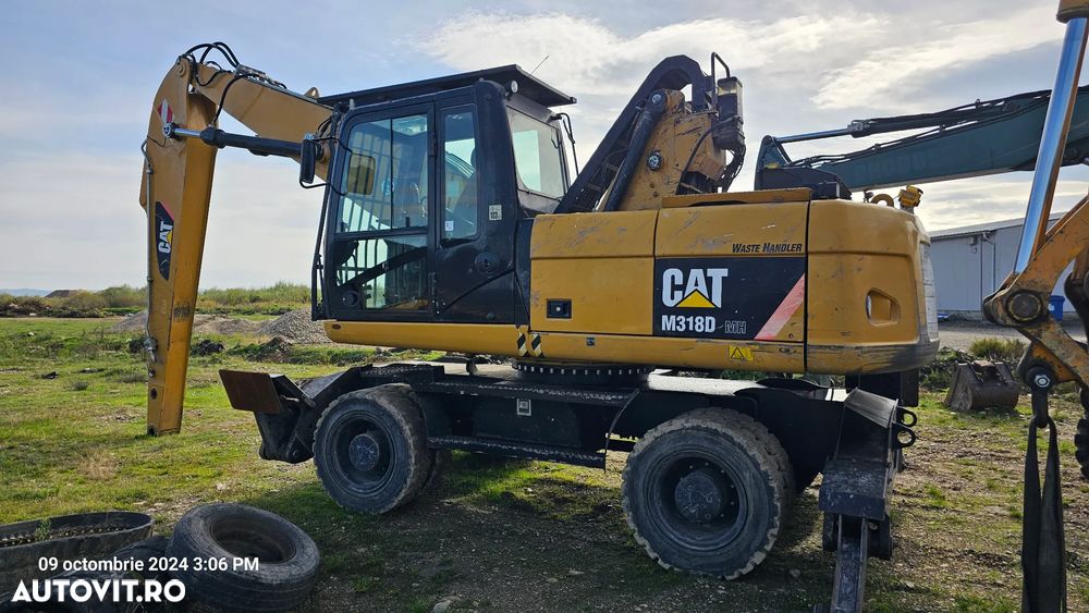 Caterpillar CAT 318 D Excavator pe roti - 1
