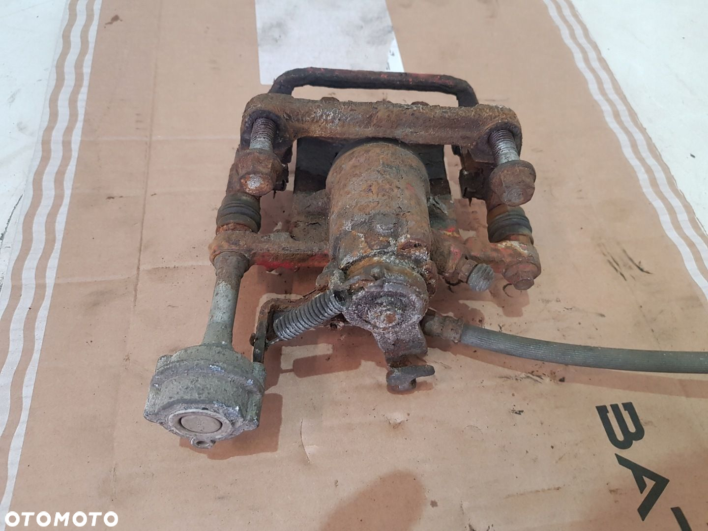 ZACISK HAMULCOWY PRAWY TYŁ OPEL ASTRA J EUR - 6