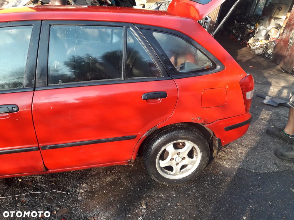 Mazda 323 323f 323  BJ 98-03  Maska lampa zderzak pas zamek w kolor SU - 4