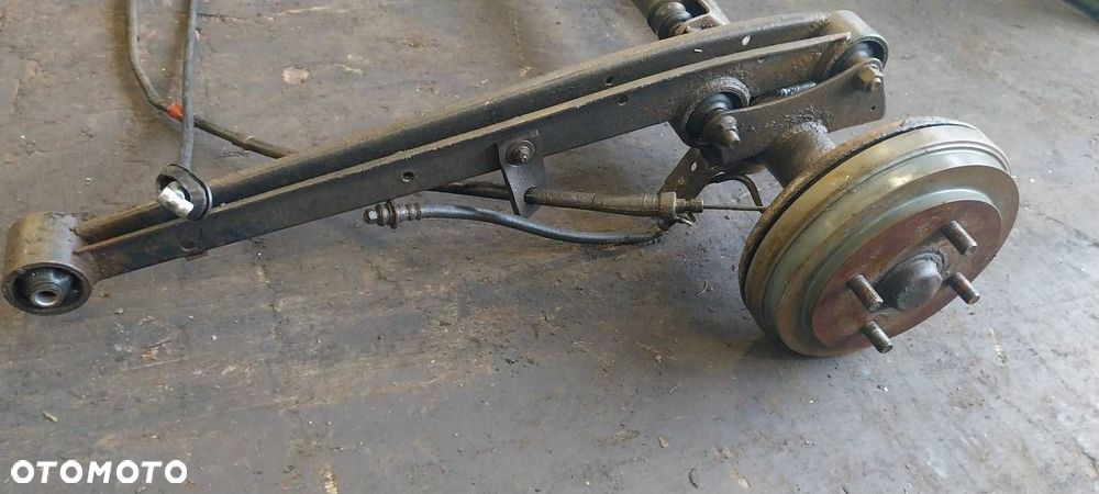 BELKA OŚ ZAWIESZENIA TYŁ BĘBNY BEZ ABS SUZUKI IGNIS I - 2