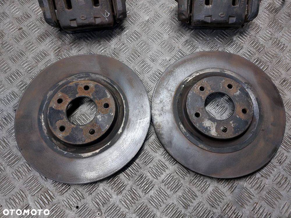 TARCZE HAMULCOWE PRZÓD + ZACISKI RENAULT KOLEOS I 2.0 DCI - 2