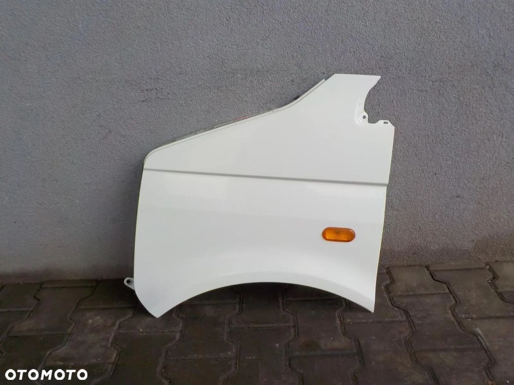 VW T5 03- BŁOTNIK LEWY BIAŁY L902 W KOLOR - 1
