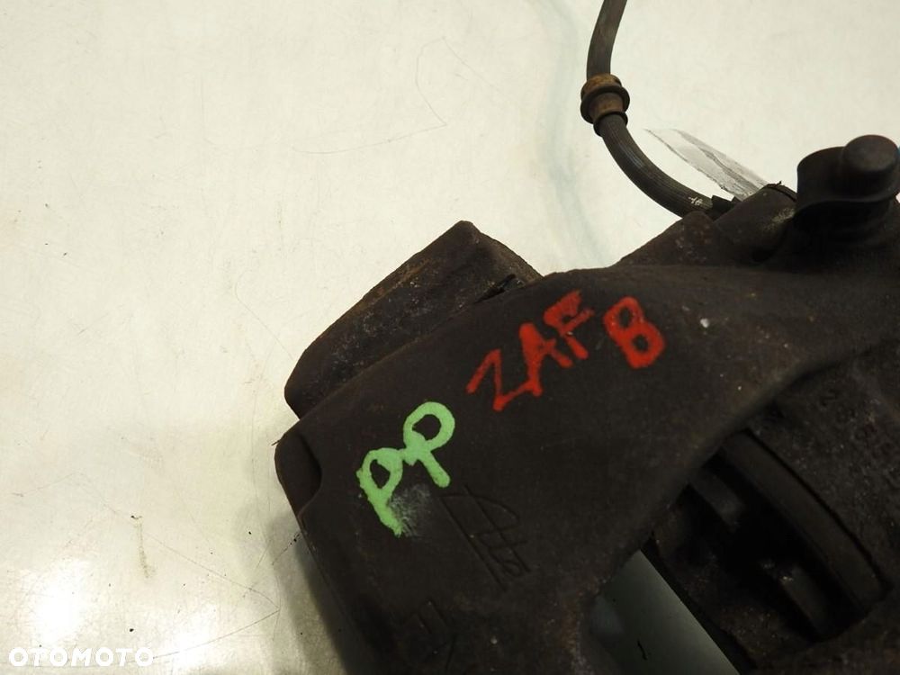 ZACISK HAMULCOWY PRAWY PRZÓD OPEL ZAFIRA B 1.9 CDTI - 2