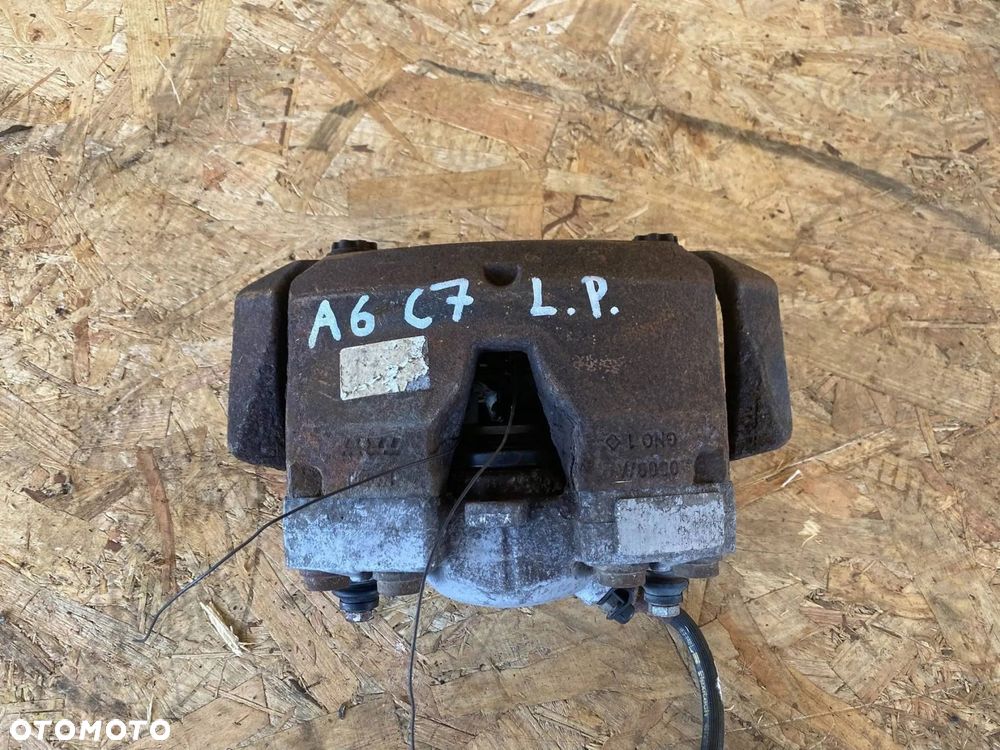 ZACISK HAMULCOWY PRZÓD LEWY AUDI A6 A7 4G 4G0105AK - 1