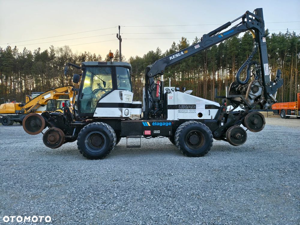 Caterpillar UNAC 300RR Mulczer kolejowy Liebherr atlas dwudrogowy zw - 1