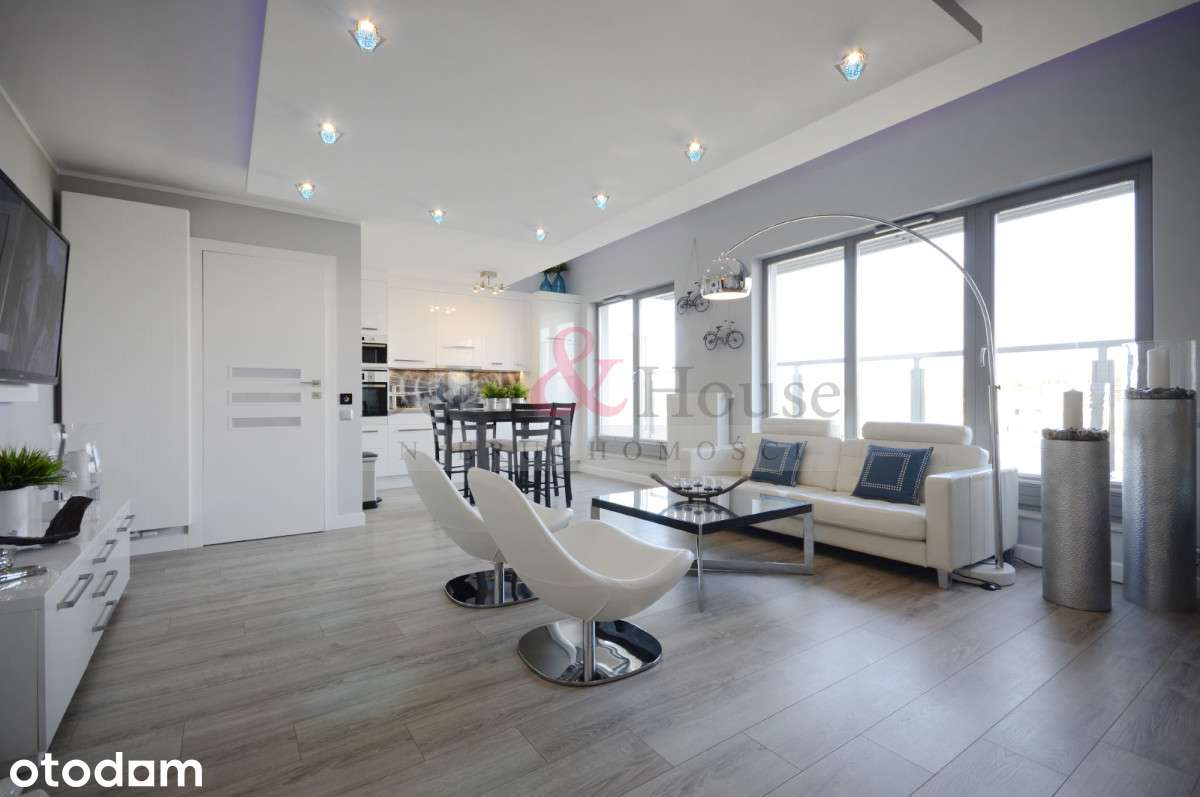 Dwupoziomowy apartament w inwestycji z basenem