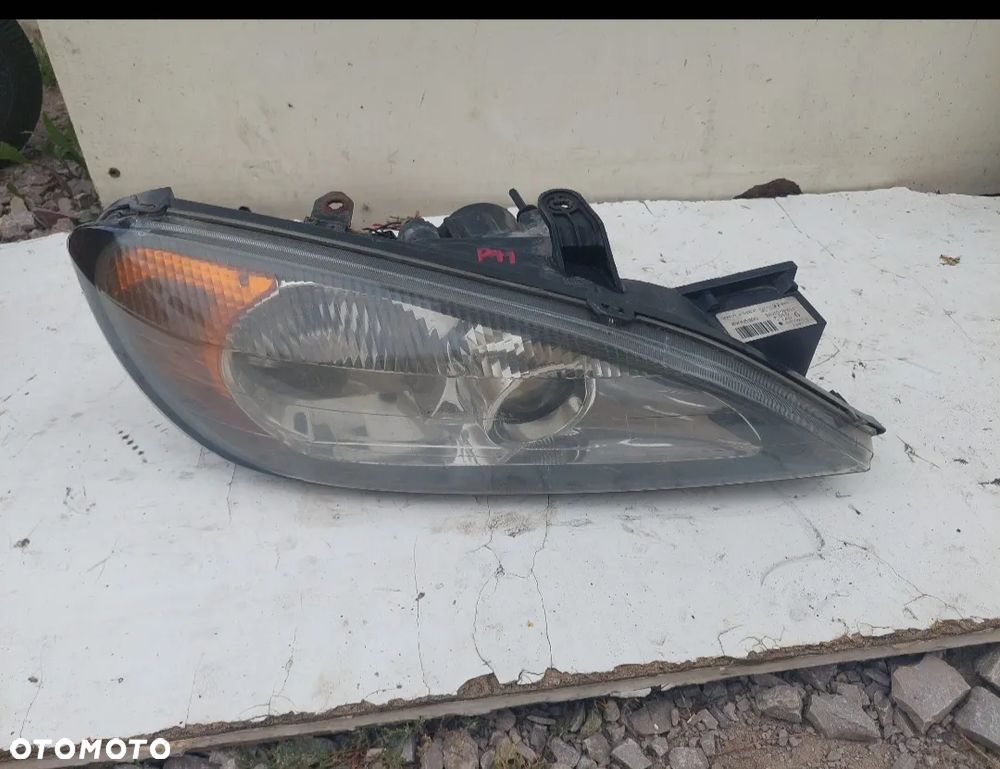 PRAWA LAMPA XENON PRAWY REFLEKTOR NISSAN PRIMERA P11 89005900 - 1