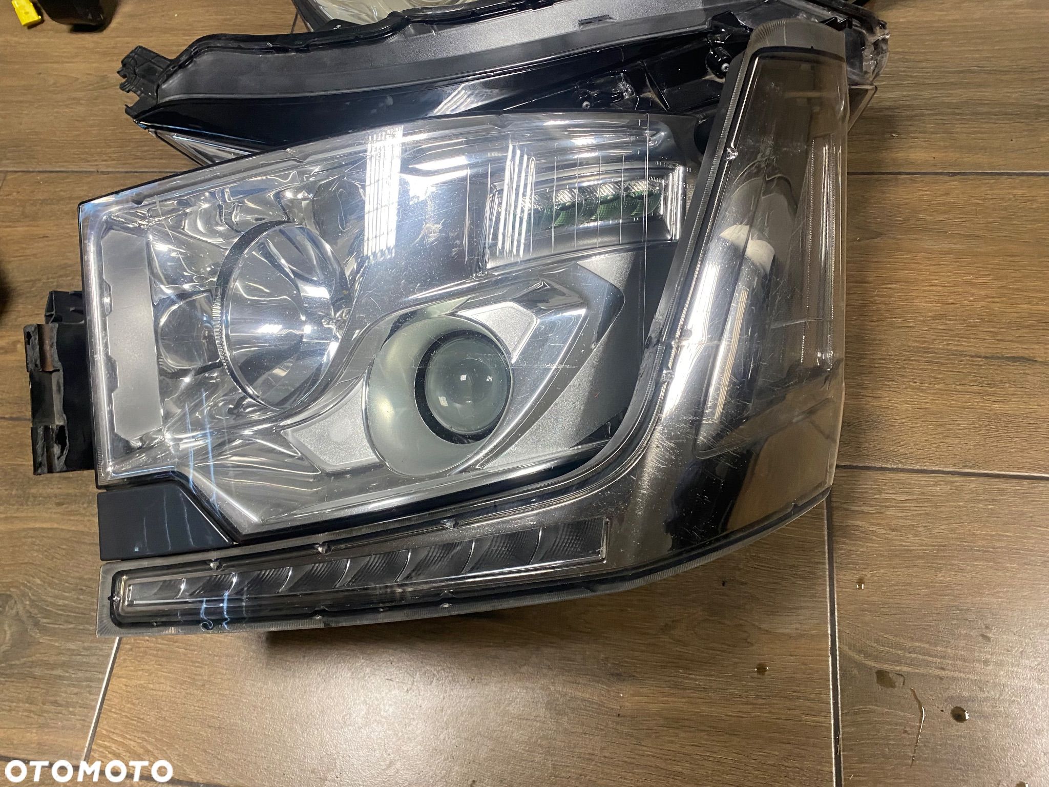 RENAULT GAMA T RANGE LAMPA LEWA PRZÓD 89207611 KMP ORG - 1