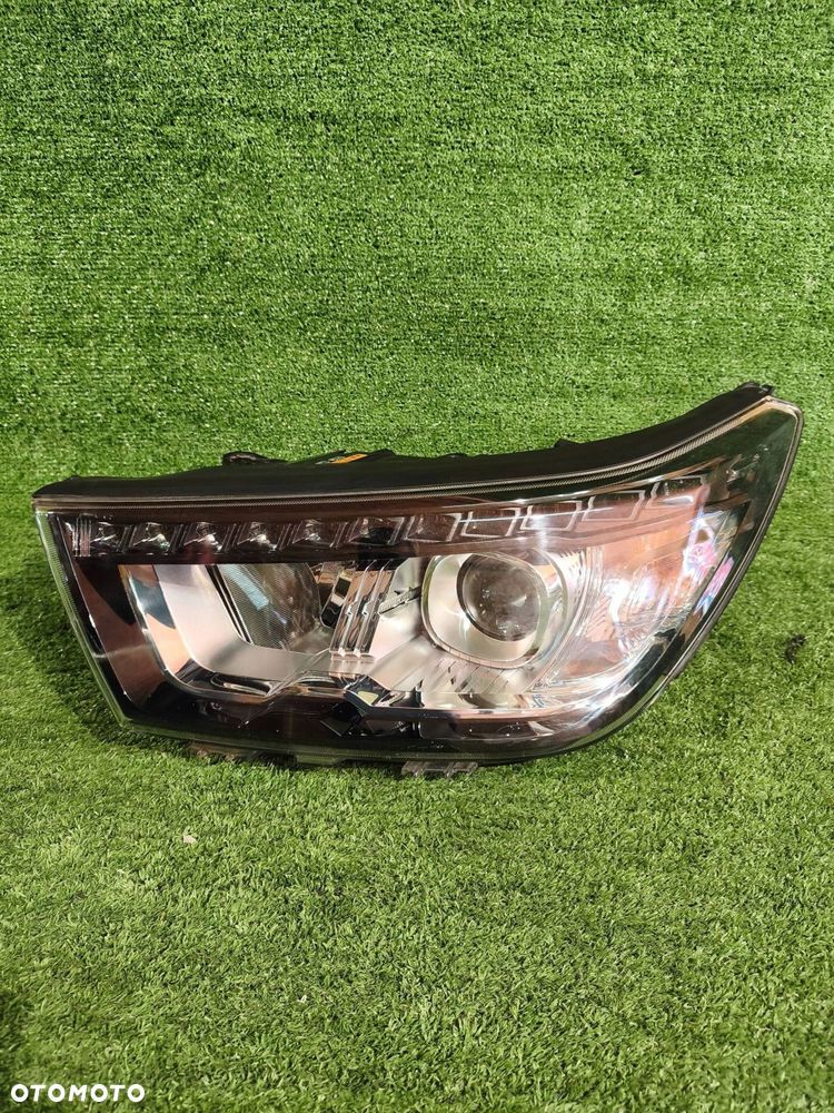 REFLEKTOR LEWY PRZÓD SSANGYONG TIVOLI 15- XENON NR.990 - 2