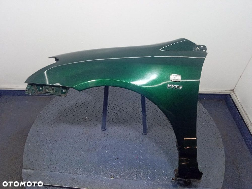 TOYOTA COROLLA E12 01-07 HB 5D BŁOTNIK PRZÓD LEWY 6R4 - 1