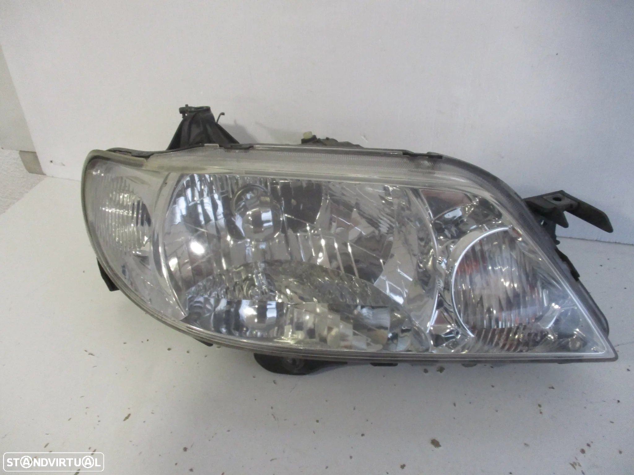 farol optica mazda 323F 2000 - 3