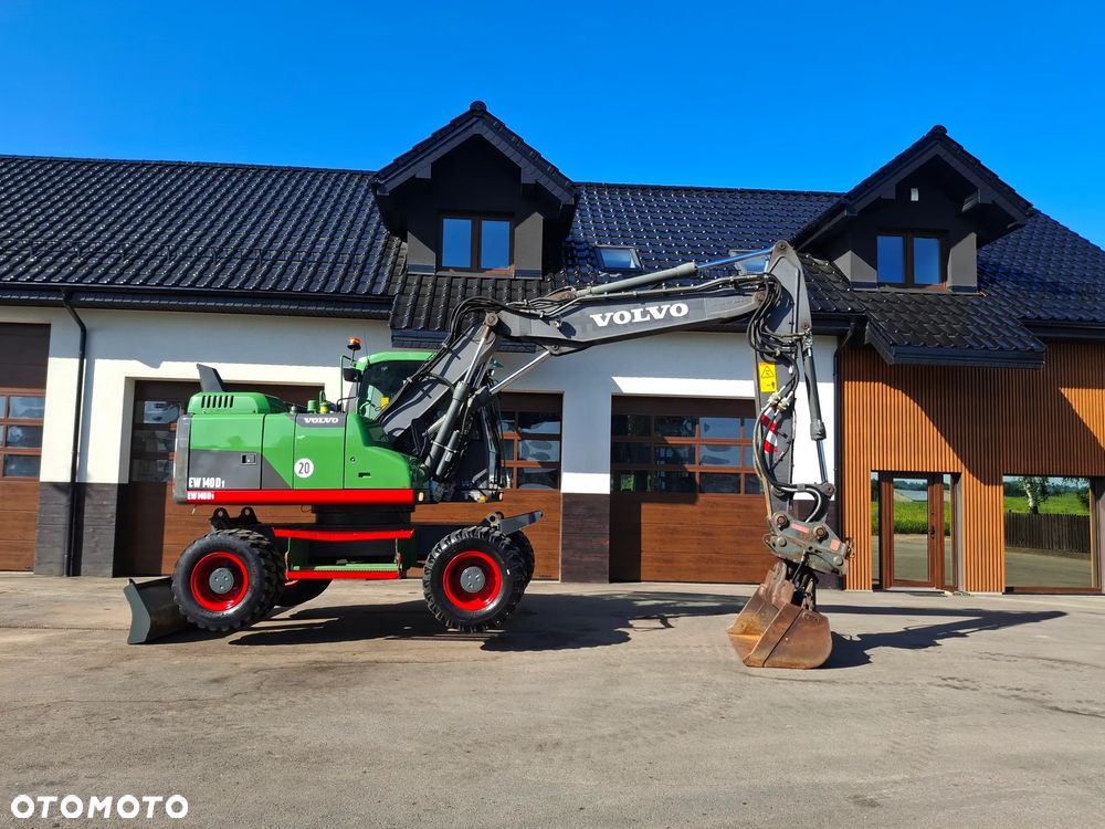 Volvo EW 140D Koparka Kołowa OilQuick Szybkozłącze Podwójne Koła 2015 Rok 2439 MTH Moc: 204 KM Dodatkowa Łyżka Pług Bardzo Dobry Stan Sprowadzona - 18