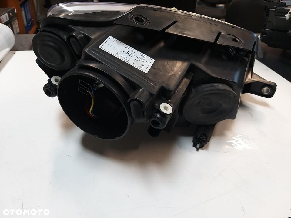 Reflektor  Lewy H7, elektryczny, , kolor wkładu: chromowany VW PASSAT 03.05-11.10  (B693) 01.05 7.10 - 4