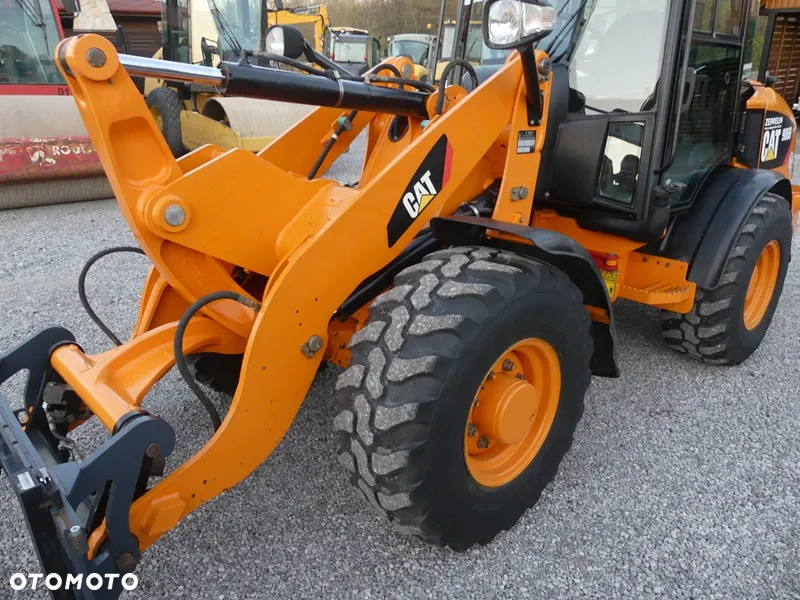 Caterpillar CAT 906H / Z Niemiec / 6424mtg / - 23