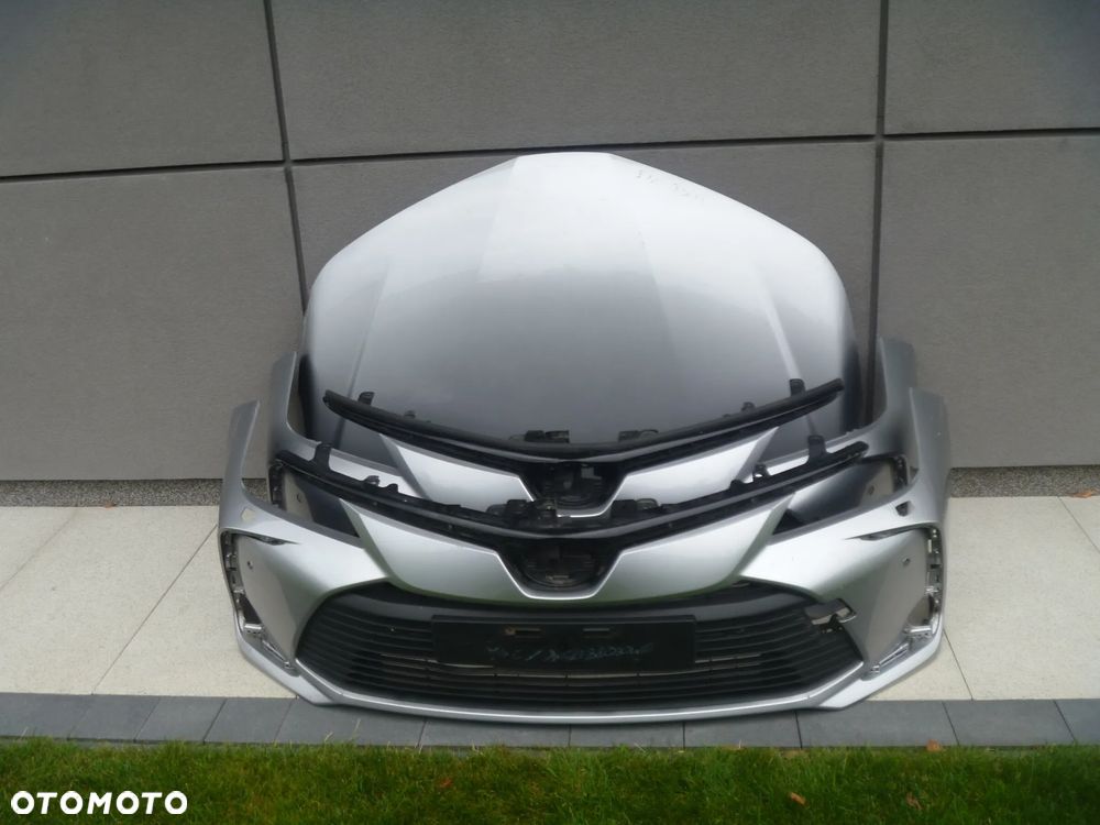 TOYOTA COROLLA E21 SEDAN ZDERZAK PRZEDNI KRATKA ATRAPA RÓŹNE WERSJE 52119-02Q10 ORYGINAŁ
