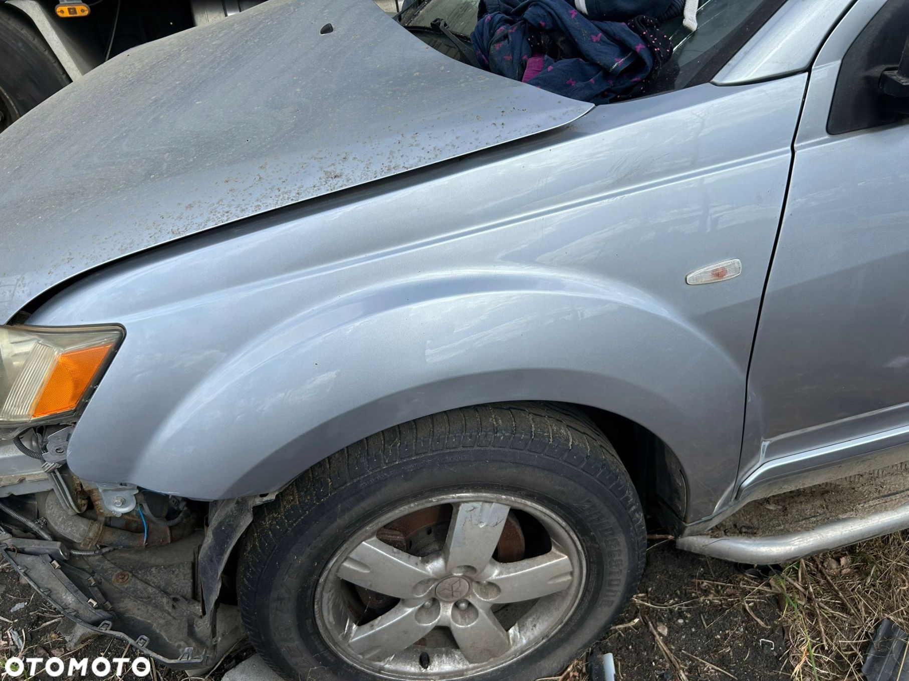 BŁOTNIK LEWY PRZÓD MITSUBISHI OUTLANDER II - 1
