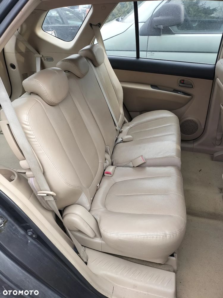 KOMPLET FOTELI  SKÓRZANYCH PRZÓD TYŁ 3 RZĄD KIA CARENS III 06-12r KOD LAK. 1U - 4