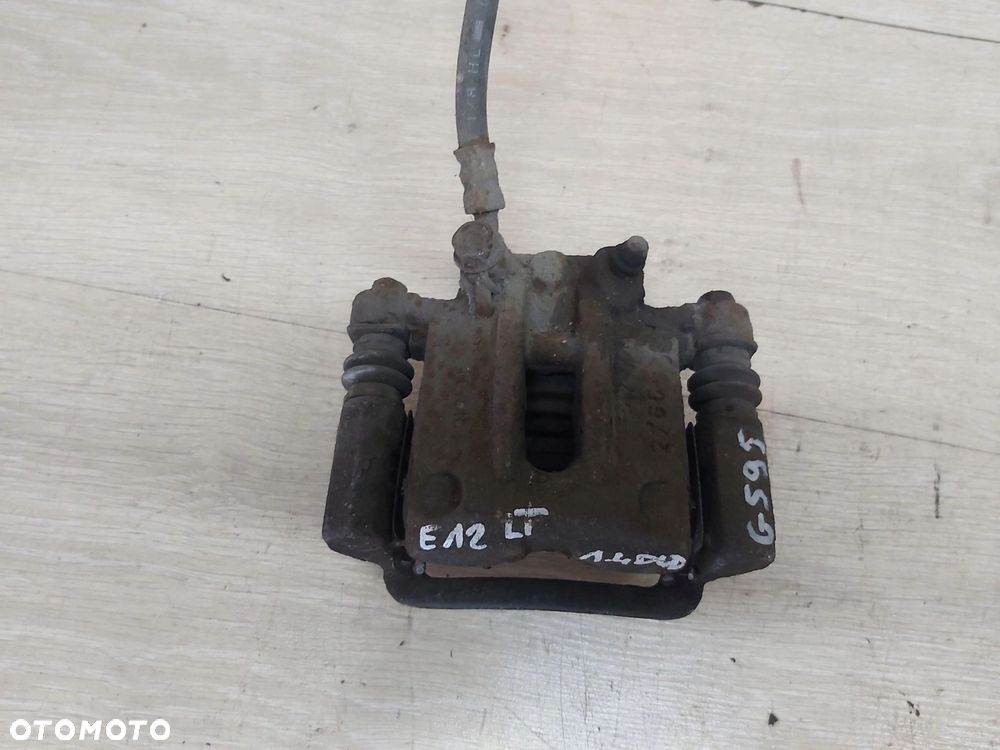 Toyota Corolla E12 zacisk jarzmo lewy tył - 2