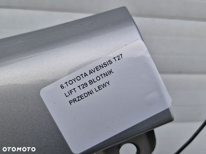 TOYOTA AVENSIS T27 LIFT T29 BŁOTNIK LEWY PRZÓD PRZEDNI 1F7 - 2
