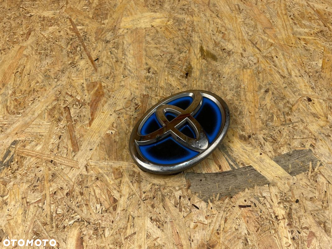 ZNACZEK EMBLEMAT ZDERZAKA ATRAPY PRZÓD TOYOTA YARIS CROSS 75310-0D010 2020- - 3