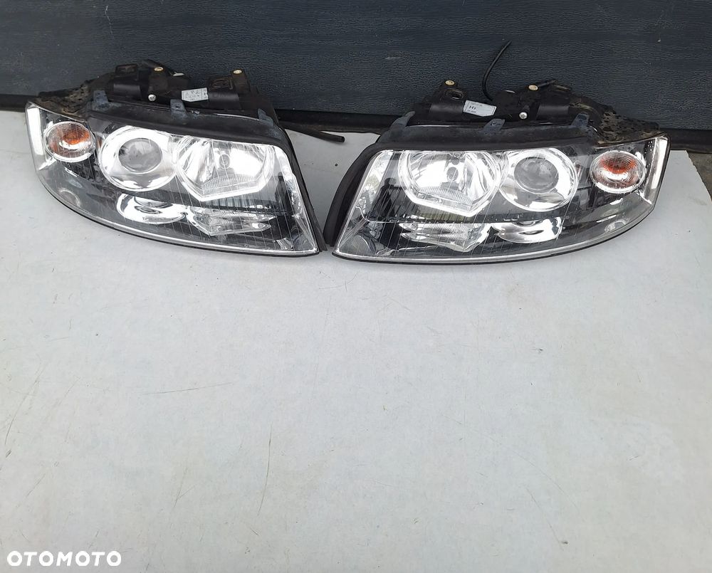 KOMPLET LAMP PRZÓD AUDI A4/B6 EUR FIRMY TYC - 1