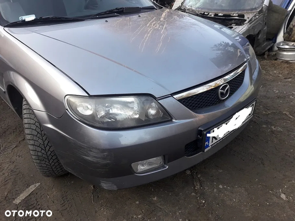 Mazda 323 323f BJ 01-03 Lift  Maska lampa zderzak pas atrapa 22V