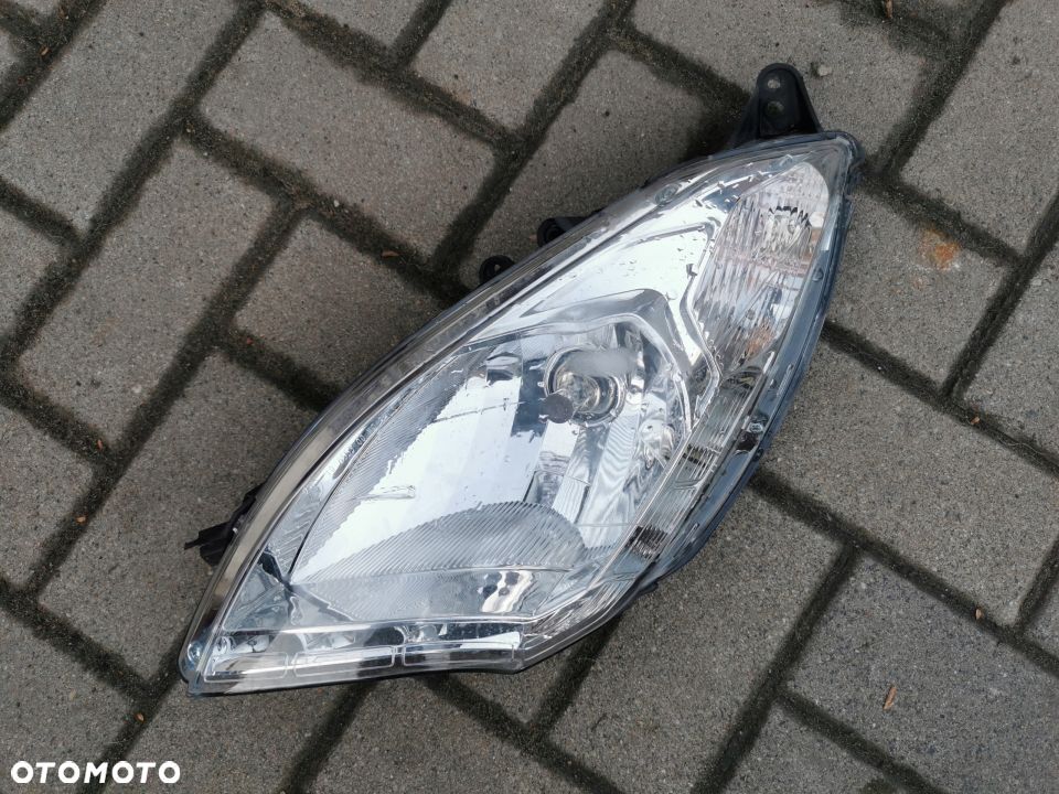 Reflektor LEWY przód Peugeot Satelis 125 14R - 1