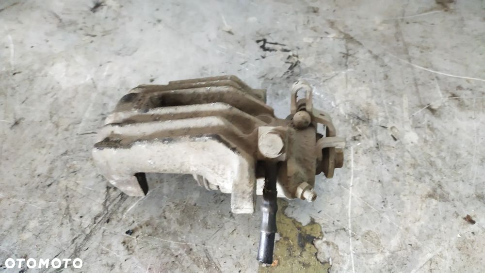 ZACISK HAMULCOWY TYŁ OCTAVIA I - 1