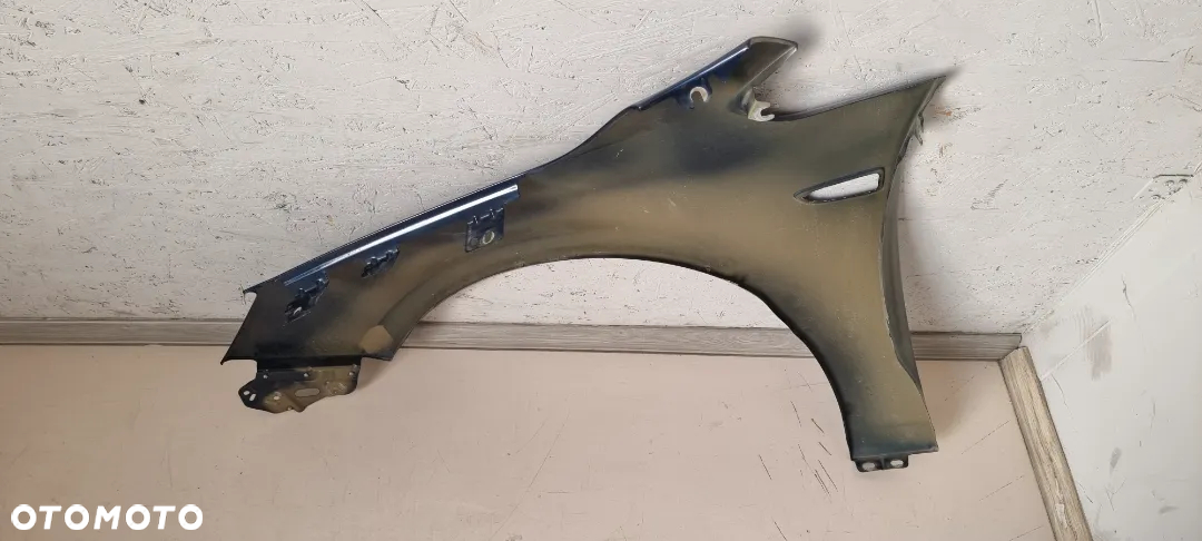 Błotnik przód prawy OPEL ASTRA J IV 4 - 5
