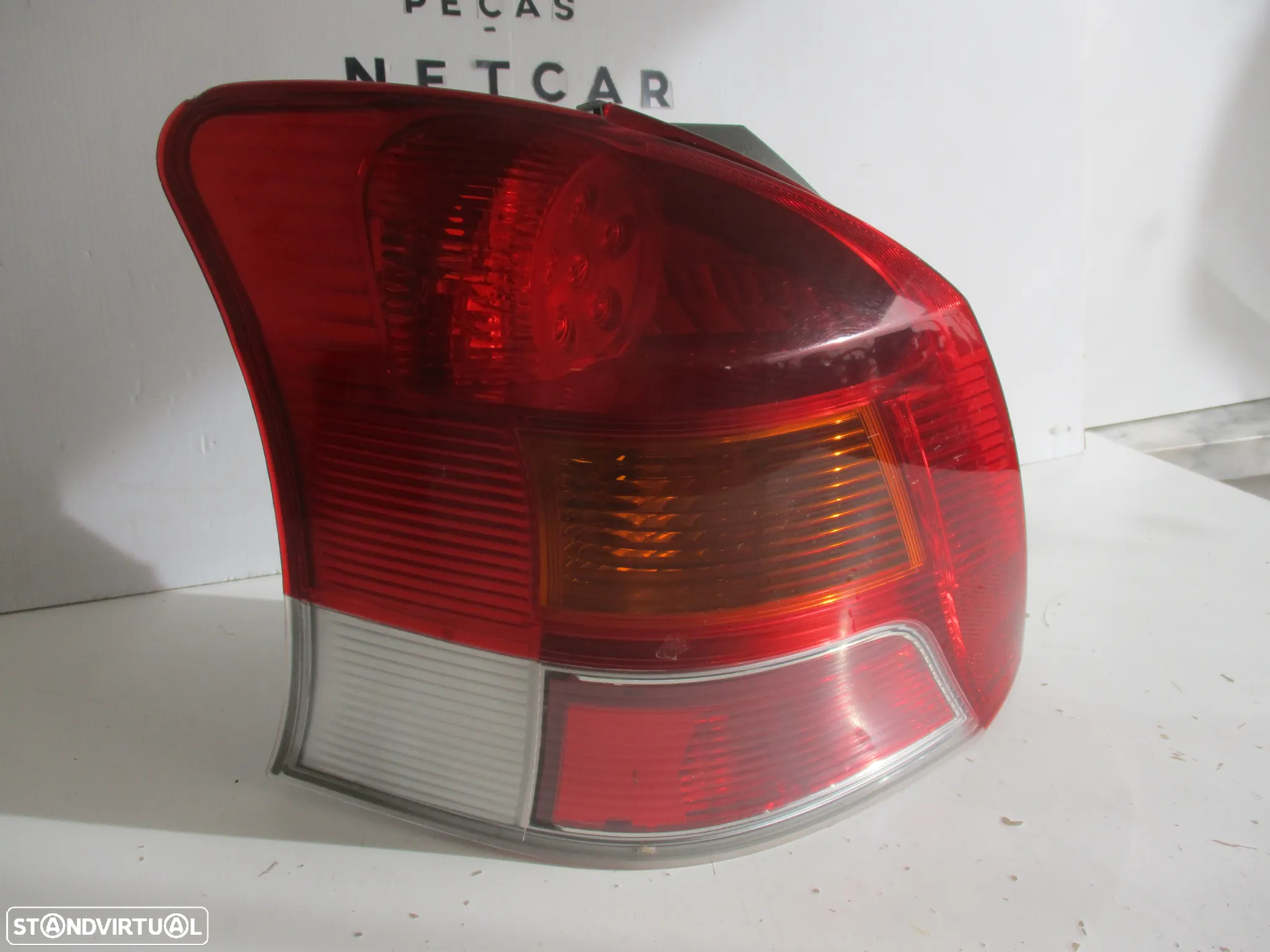 farol farolim toyota yaris 2009 - 2