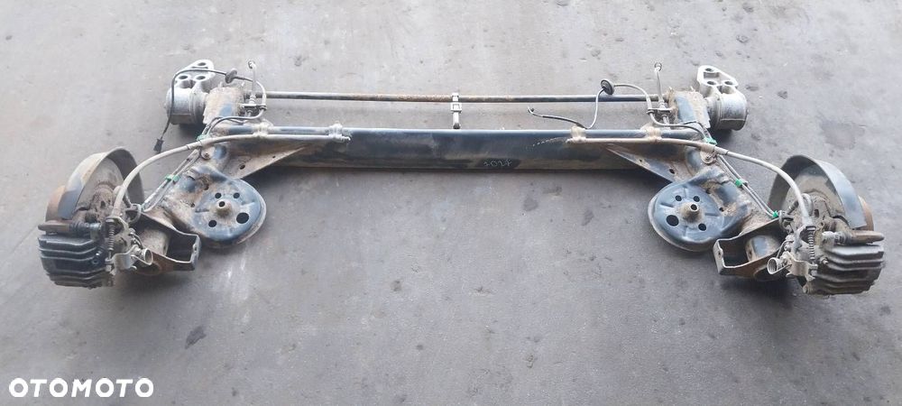 BELKA OŚ ZAWIESZENIA TYŁ TARCZE Z ABS HAMULCE ZACISKI SKODA SUPERB I - 1