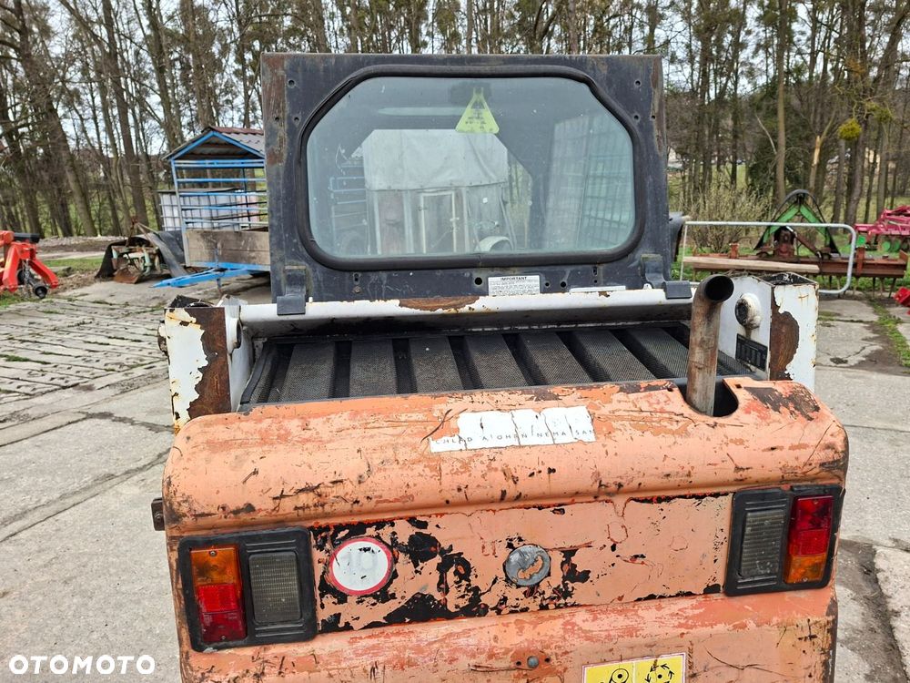 Bobcat 553 4X4 + Melroe Ingersoll-Rand 725S B/H - 28
