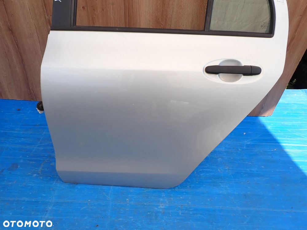 TOYOTA YARIS II 06-11 5d DRZWI TYLNE LEWE 1E7 - 2