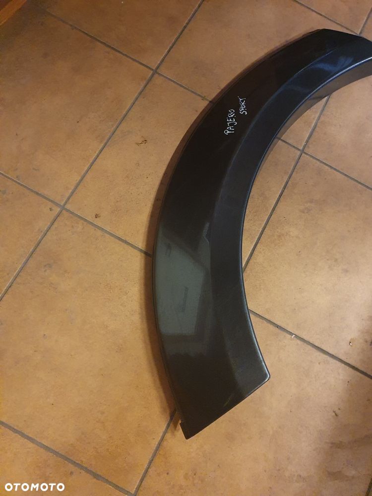 NAKŁADKA BŁOTNIKA MITSUBISHI PAJERO SPORT LEWA TYLNA 99-06 KOD A75 - 3