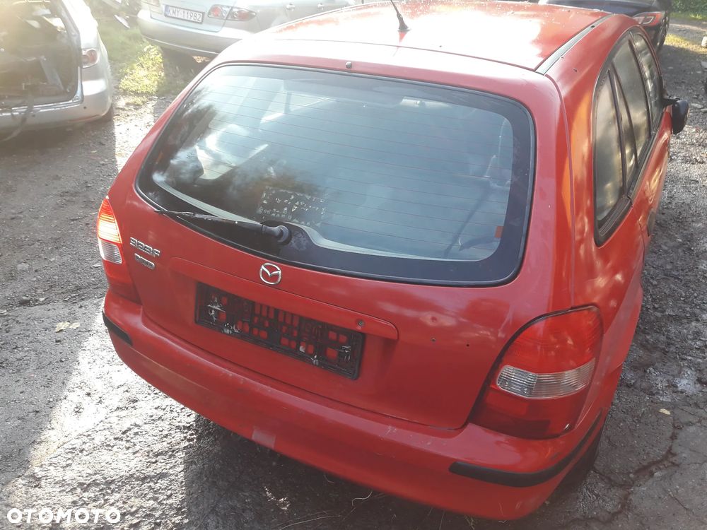 Mazda 323 323f 323  BJ 98-03  Maska lampa zderzak pas zamek w kolor SU - 8