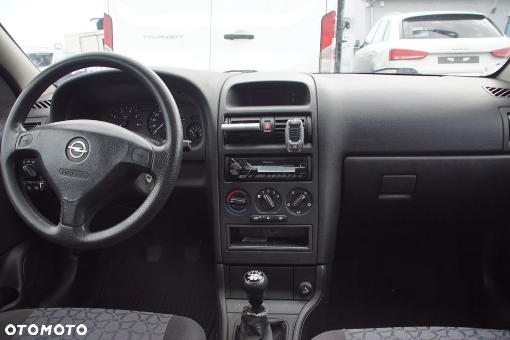 Auto na części - Opel Astra II G 1.6 16V 101 KM X16XEL F17 Z147 1999R Silnik Skrzynia Drzwi Maska Błotnik Zderzak Klapa Lampa Lusterko Klamka Szyba Deska Kokpit Sterownik Moduł Czujnik Licznik Panel Kierownica - 17