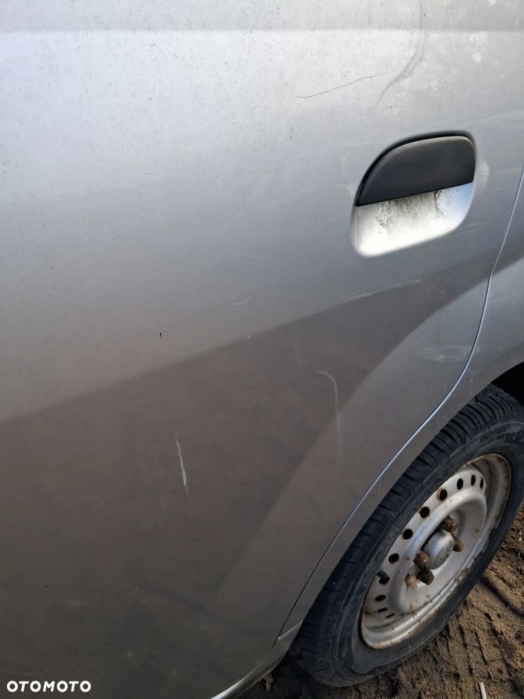 Daihatsu cuore 03 drzwi lewy tyl E28 - 5