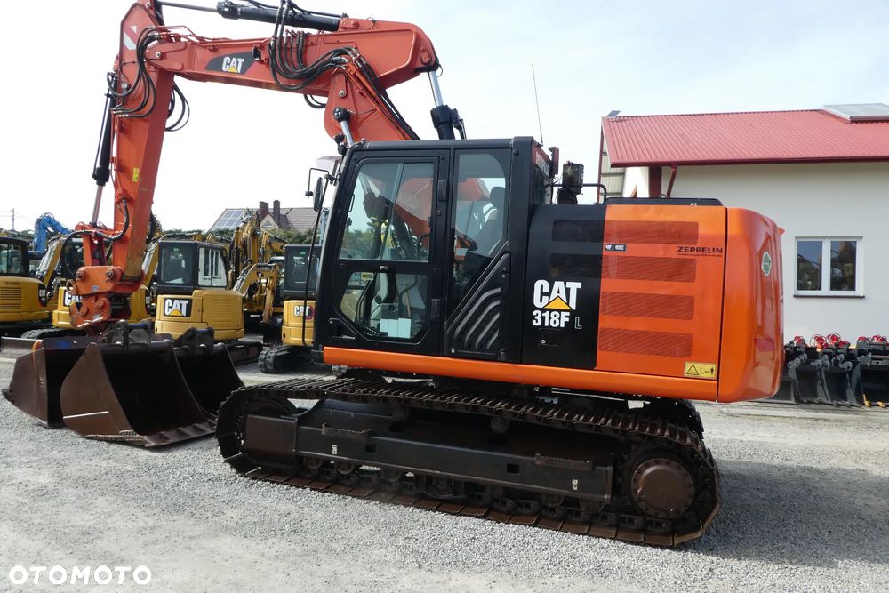 Caterpillar M 318F Z NIEMIEC TRZY ŁYŻKI - 34