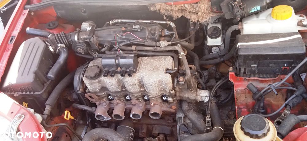 Na części Chevrolet Aveo Kalos 1.2 lak. 06U silnik skrzynia zderzak maska drzwi klapa bagażnika błotnik fotele deska rozdzielcza zawieszenie - 3